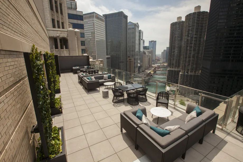 A rooftop overlooking the Chicago River and skyline.