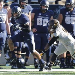 USU's Brandon Swindall tries to outrun the defense down the sideline as Utah State and Wyoming play Saturday, Nov. 30, 2013, in Logan. USU won, 35-7.