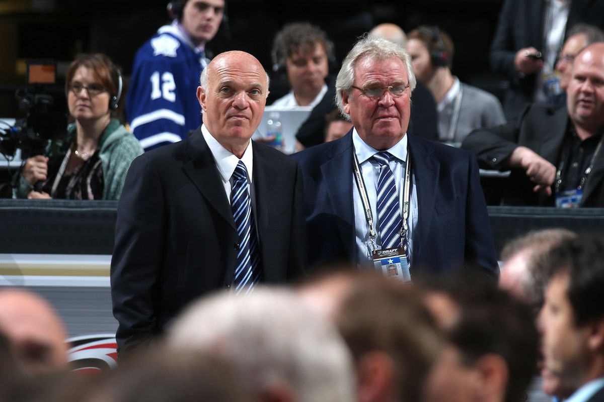 Lou (left) thinks: "I will re-sign those who want to stay."  Sather (right) thinks: "Maybe I won't spend so much of Mr. Dolan's money this summer."  (Photo by Bruce Bennett/Getty Images)