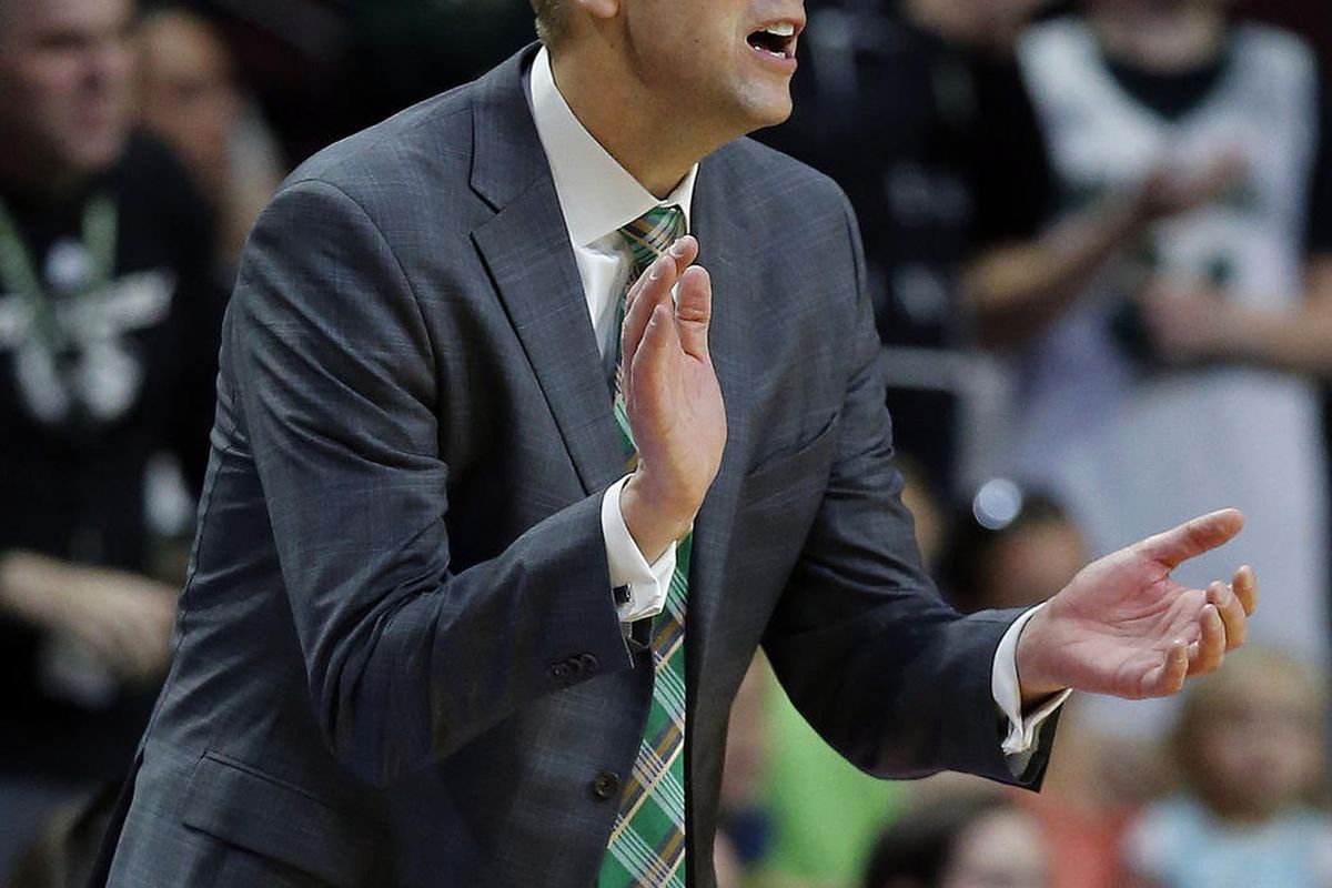 Utah Valley Wolverines head coach Mark Pope yells encouragement during play against Grand Canyon in the Western Athletic Conference basketball tournament in Las Vegas on Friday, March 9, 2018.