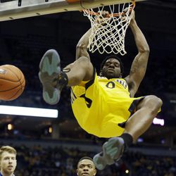Marquette's Jamil Wilson dunks during the first half of an NCAA college basketball game against Seton Hall, Saturday, Jan. 11, 2014, in Milwaukee. (AP Photo/Morry Gash)