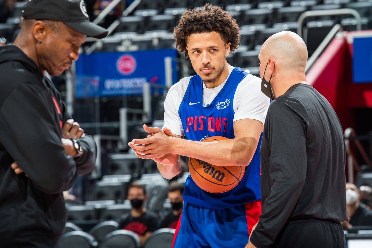 Cade Cunningham #2 of the Detroit Pistons talks to his coaches during open practice at the Little Caesars Arena on October 9, 2021 in Detroit, Michigan.&nbsp;