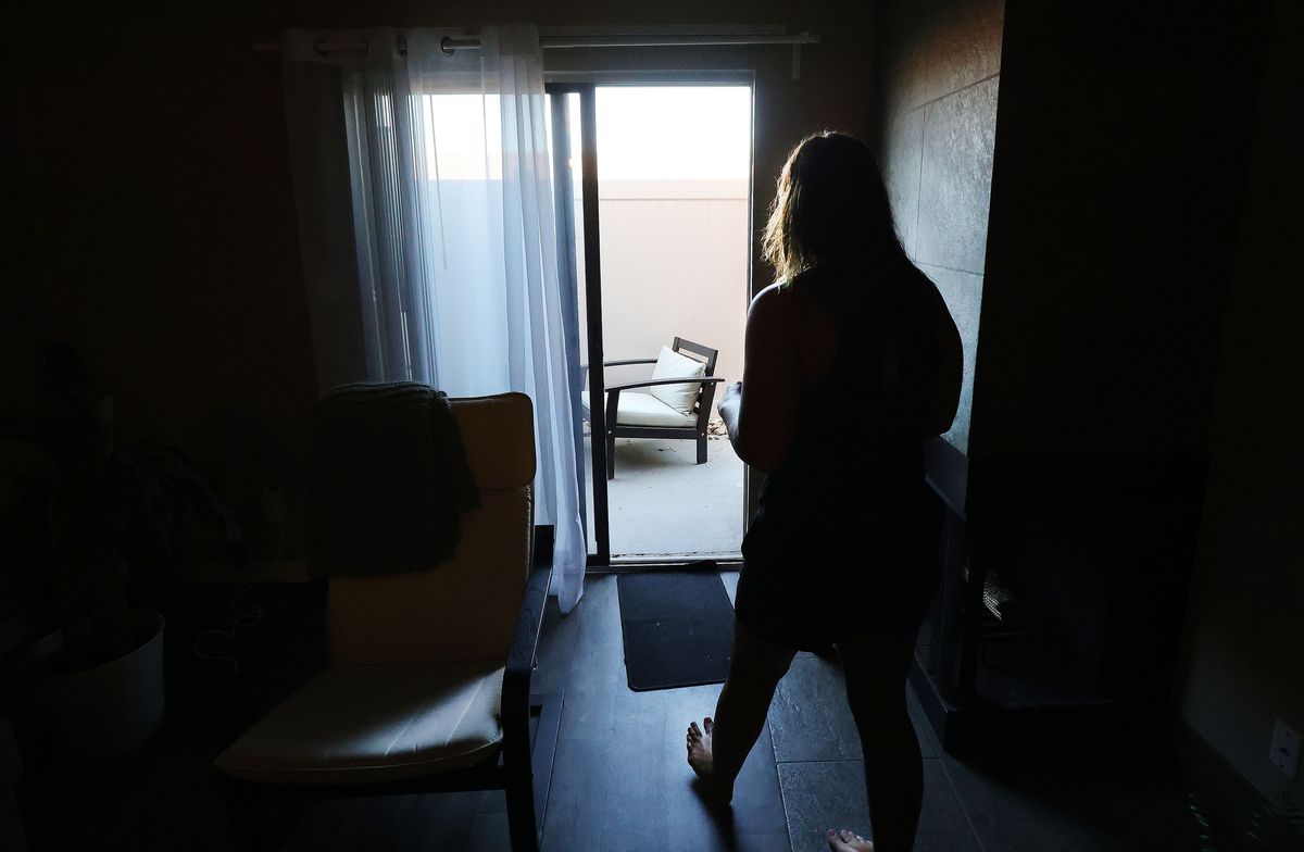 Kayla Smartz walks out to her patio of her apartment in Salt Lake City on Friday, June 4, 2021.