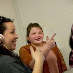 Robbin Keating Clark, expanded core curriculum coordinator for the Utah Schools for the Deaf and the Blind, left, listens to a musical piece created by Jeannie Schunuman, a student at the school, at Spy Hop in Salt Lake City on Friday, Feb. 15, 2019.