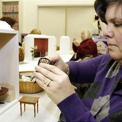 In this photo made on Feb. 4, 2010, Darlene Patrick works on her miniature room design plan during a class she takes in Greensburg, Pa.