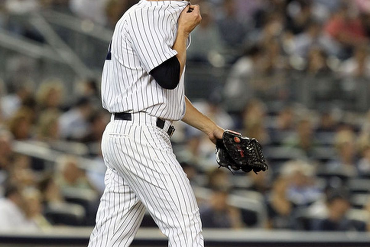 NEW YORK, NY - SEPTEMBER 22:  Scott Proctor #41 of the New York Yankees walks to the mound against the New York Yankees on September 22, 2011 at Yankee Stadium in the Bronx borough of New York City.  (Photo by Jim McIsaac/Getty Images)