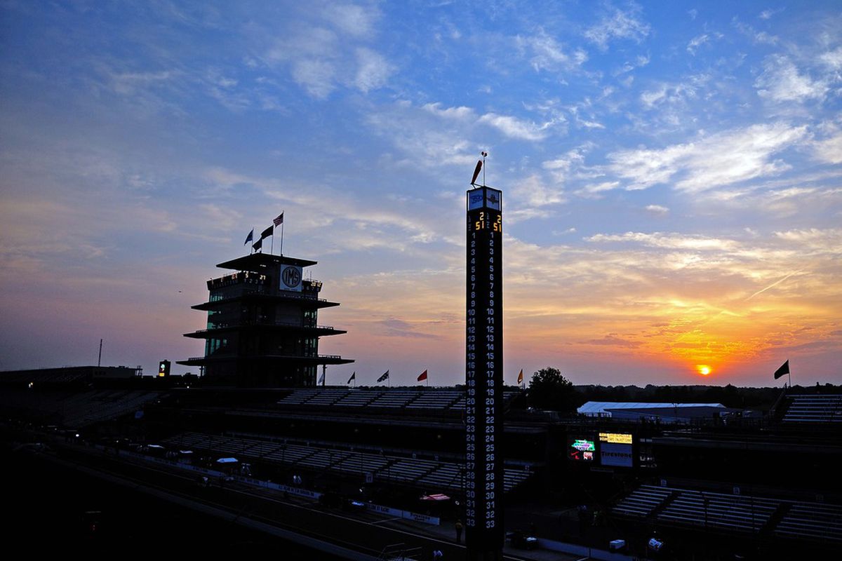 May 27, 2012; Indianapolis, IN, USA; The sun rises over the front stretch grandstands and scoring pylon prior to the running of the Indianapolis 500 at the Indianapolis Motor Speedway. Mandatory Credit: Andrew Weber-US PRESSWIRE