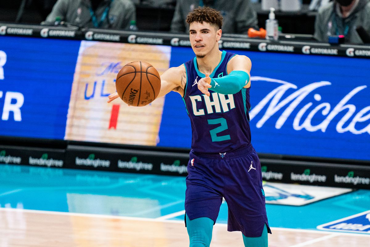 LaMelo Ball of the Charlotte Hornets passes the ball against the Houston Rockets during their game at Spectrum Center on February 08, 2021 in Charlotte, North Carolina.