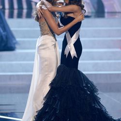 From left, Miss Connecticut Erin Brady is congratulated by Miss Alabama Mary Margaret McCord for the winning of the Miss USA 2013 pageant, Sunday, June 16, 2013, in Las Vegas. (AP Photo/Jeff Bottari)