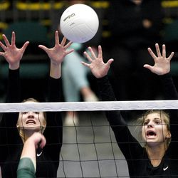 Desert Hills' Lindsey Jones, left, and Samantha Loe reach for a block during the 3A championship.  
