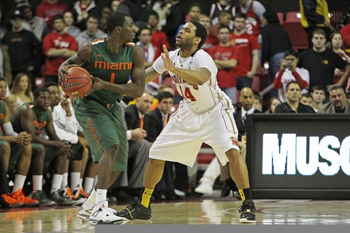 February 21, 2012; College Park, MD, USA; Miami Hurricanes guard Durand Scott (1) defended by Maryland Terrapins guard Sean Mosley (14) at Comcast Center. Mandatory Credit: Mitch Stringer-US PRESSWIRE
