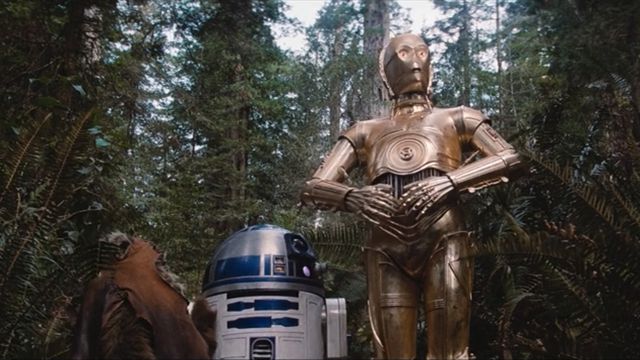 C-3PO, R2-D2, and Wicket the Ewok on the forest moon of Endor from Star Wars: Return of the Jedi