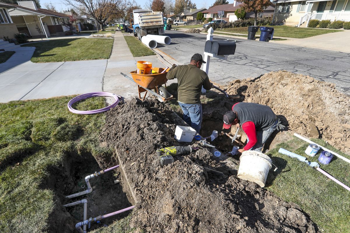 Ormond Construction crews install secondary water meters in a subdivision in Woods Cross for the Weber Basin Water Conservancy District on Thursday, Nov. 7, 2019. The water district is committed to the conservation of water and will be installing the meters within its service area to promote the efficient and responsible use of the resource. With the new meters, homeowners will be able to see their secondary water consumption use.