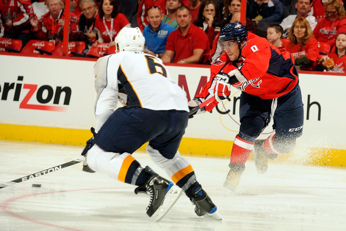 WASHINGTON - OCTOBER 03:  Alex Ovechkin #8 of the Washington Capitals passes the puck pass Shea Weber #6 of the Nashville Predators at Verizon Center on October 3 2010 in Washington DC.  (Photo by Greg Fiume/Getty Images)