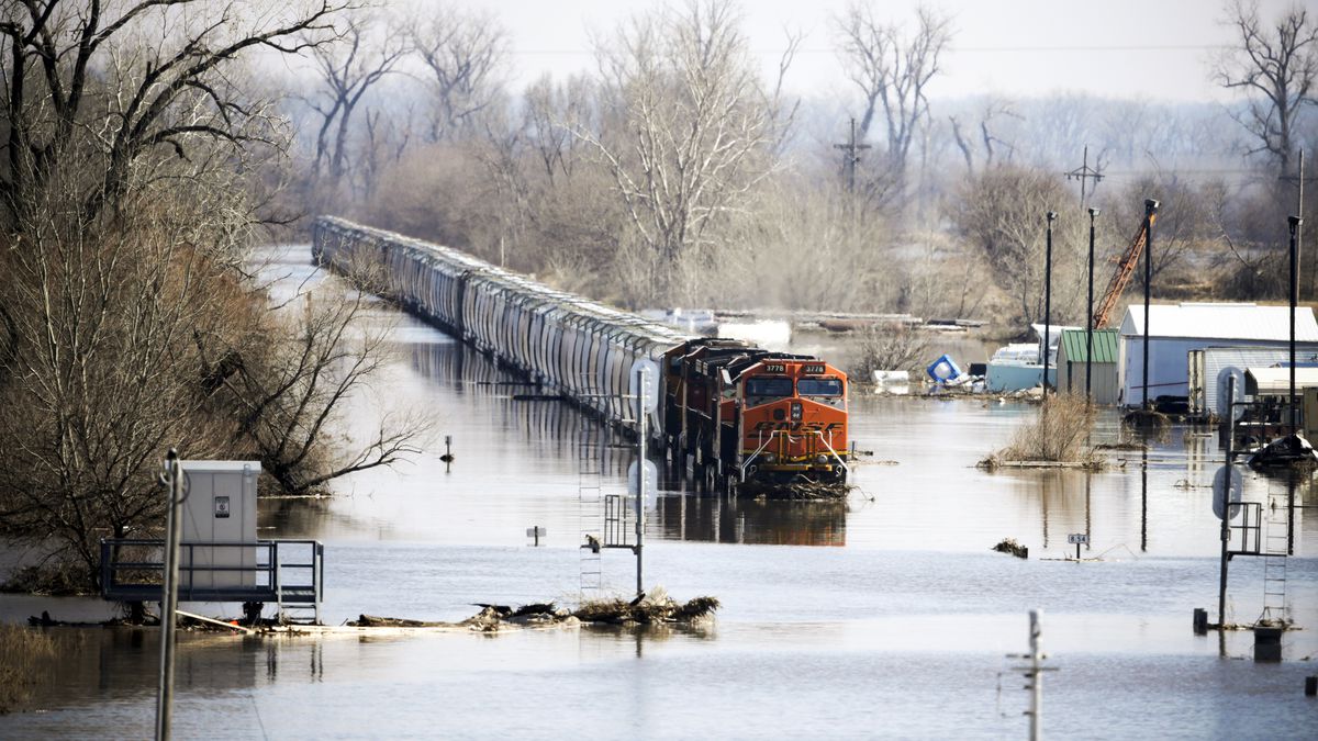 A freight train sits idle in flood waters from the Platte River, in Plattsmouth, Nebraska on March 17, 2019.