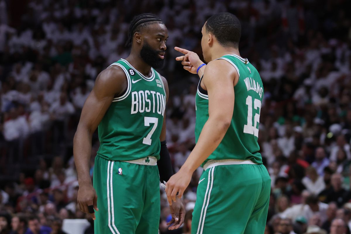 Jaylen Brown #7 and Grant Williams #12 of the Boston Celtics interact against the Miami Heat during the fourth quarter in game four of the Eastern Conference Finals at Kaseya Center on May 23, 2023 in Miami, Florida.&nbsp;