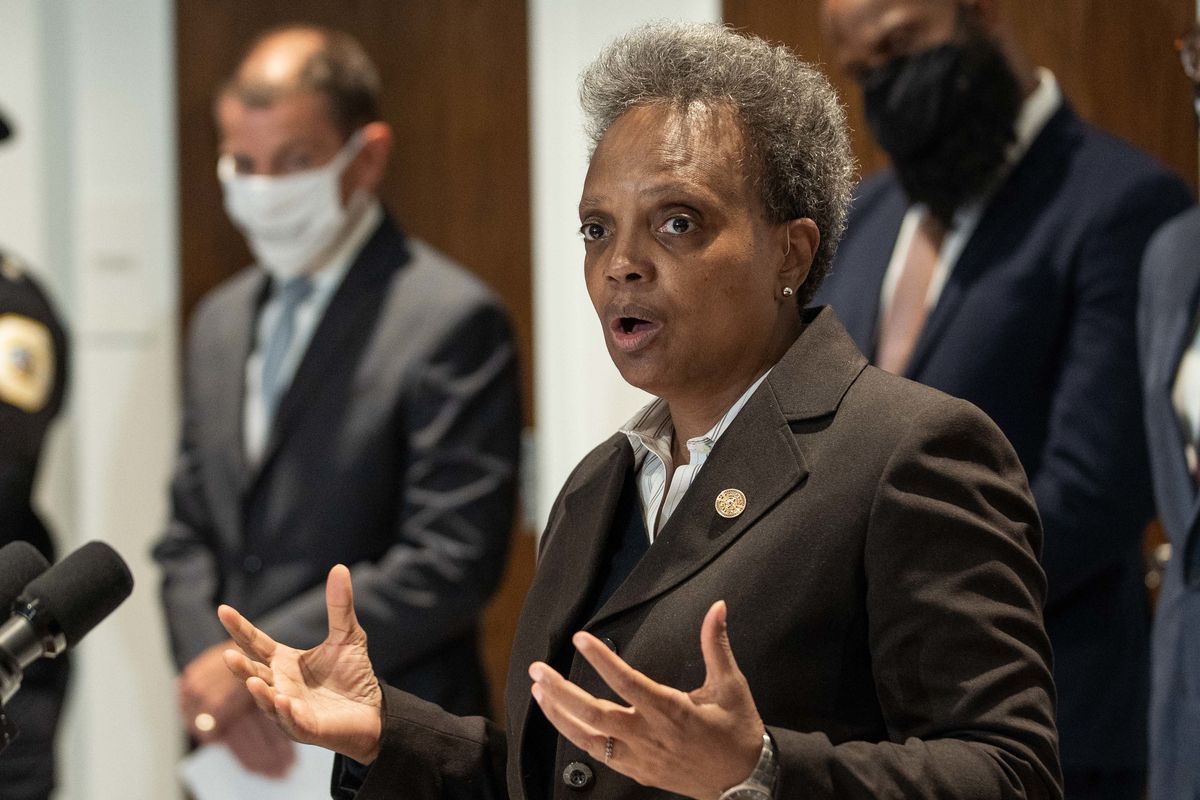 Mayor Lori Lightfoot outlines a holistic approach to curbing violence this summer during a news conference at Whitney Young Library in the Chatham neighborhood, 