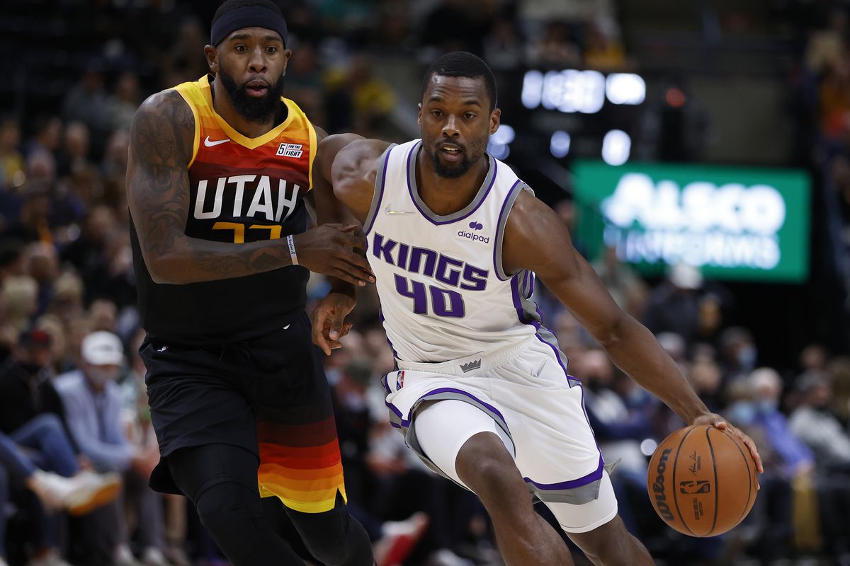 Sacramento Kings forward Harrison Barnes (40) dribbles around Utah Jazz forward Royce O’Neale (23) in the first quarter at Vivint Arena.
