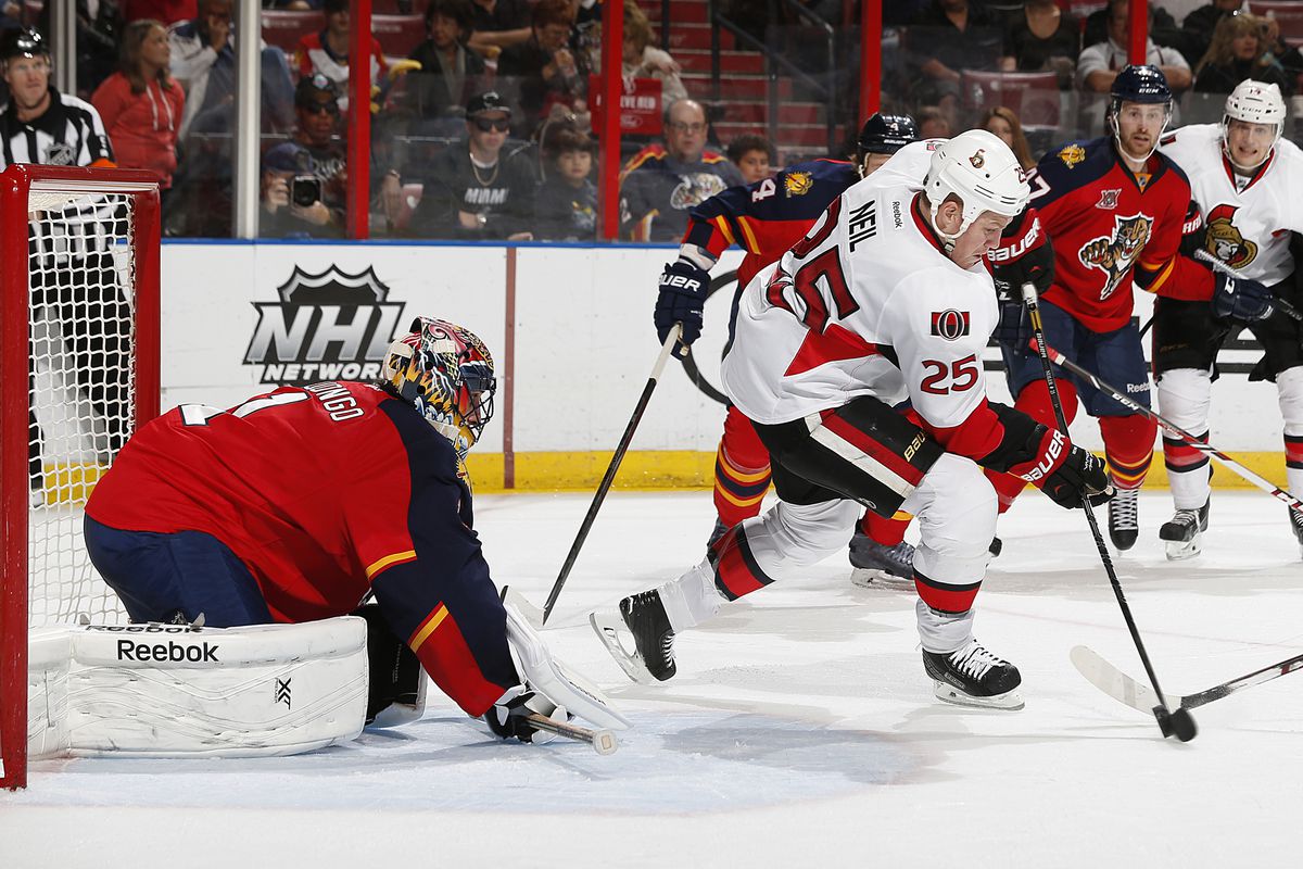 Chris Neil fires a puck past Roberto Luongo ... no, not really.