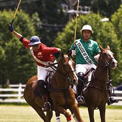 Professional polo player Robert Koehler of New York swings the mallet in attempt to pass the ball upfield against Santiago Mendez of Argentina during Pharmacy Cup match, which benefited the University of Utah College of Pharmacy. Dean's Demons beat the Miller 4-Runners 15-11 in South Jordan Saturday. 