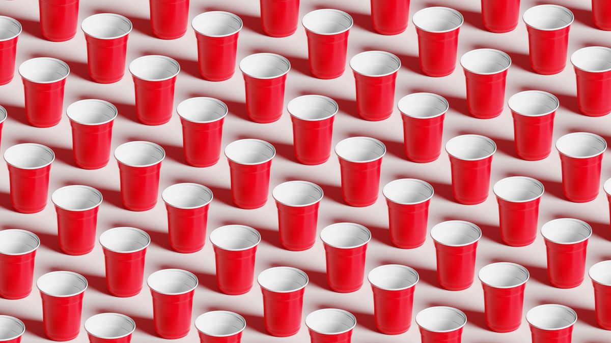 Red plastic cups laid out in lines.