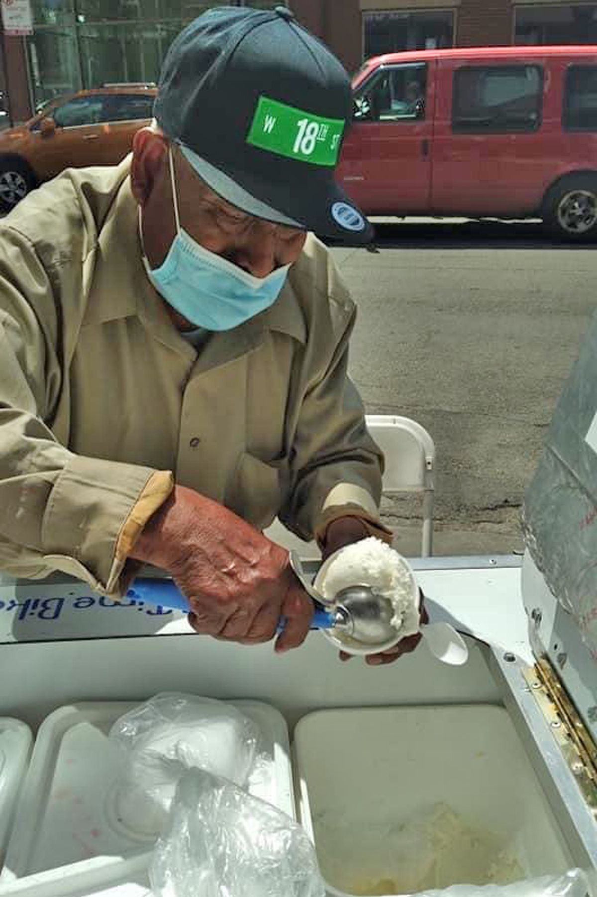 Don Ananías Ocampo dishing up ice cream in Pilsen.