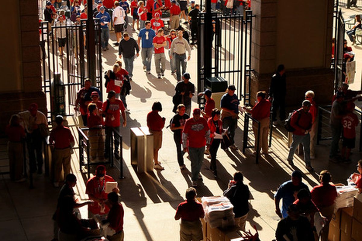 Fans enter the stadium for today's World Series game- will this be the last game of the Major League season?