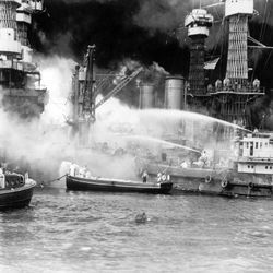 The battleship USS West Virginia is seen afire after the Japanese surprise attack on Pearl Harbor, Hawaii, on December 7, 1941. Capt. Mervyn S. Bennion was killed in action during the Japanese attack on Pearl Harbor, while in command of the battleship.