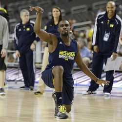 Michigan's Tim Hardaway Jr. dances on the floor during practice the NCAA Final Four tournament college basketball semifinal game against Syracuse, Friday, April 5, 2013, in Atlanta. Michigan plays Syracuse in a semifinal game on Saturday. 