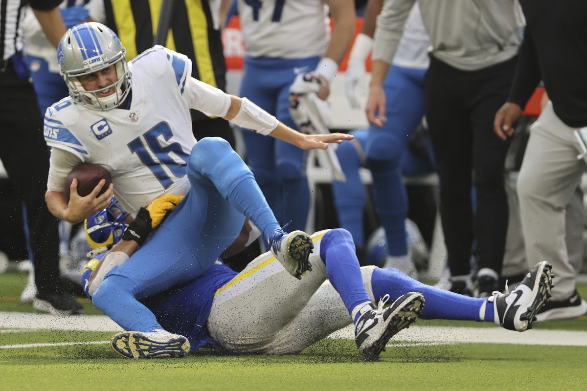 Jared Goff #16 of the Detroit Lions is sacked by Kenny Young #41 of the Los Angeles Rams during the second half in the game at SoFi Stadium on October 24, 2021 in Inglewood, California.