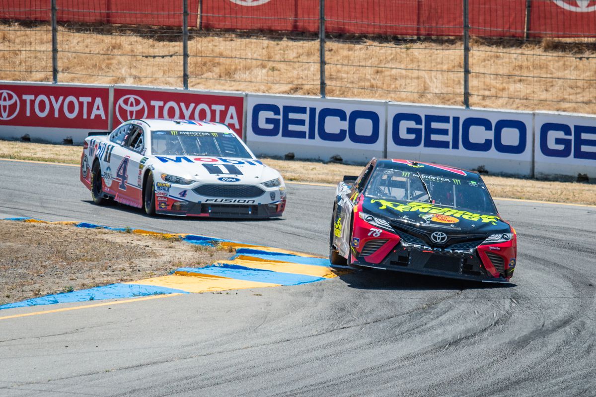Martin Truex Jr., driving the #(78) Toyota for Furniture Row Racing maintains a slight lead on Kevin Harvick, driving the (4) Ford for Stewart-Haas Racing on Sunday, June 24, 2018 at the NASCA Cup Series Toyota/Save Mart 350 Race at Sonoma Raceway, Sonoma, CA