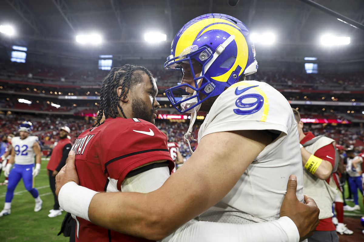 Kyler Murray #1 of the Arizona Cardinals and Matthew Stafford #9 of the Los Angeles Rams meet following a game at State Farm Stadium on September 25, 2022 in Glendale, Arizona.