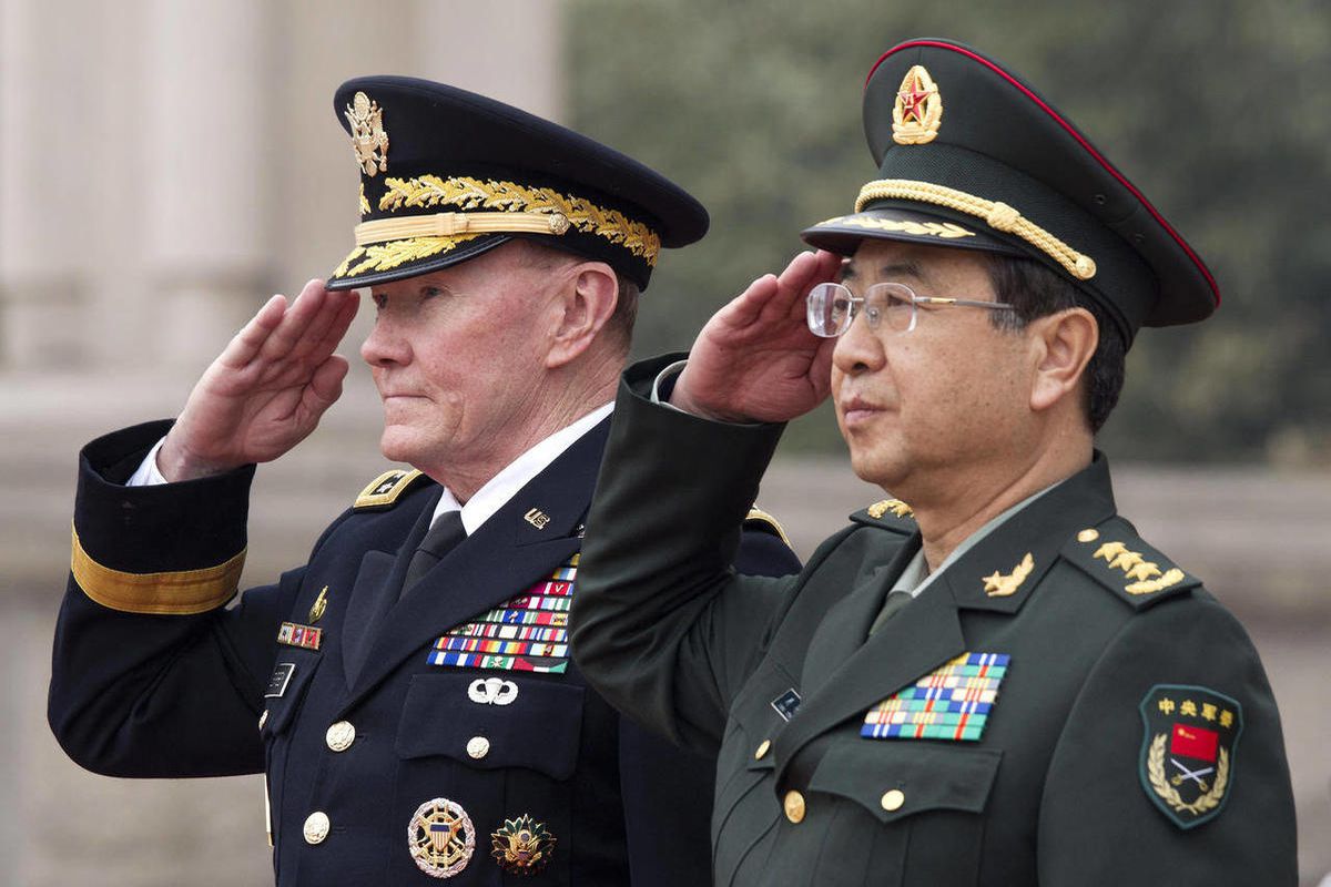 Joint Chiefs Chairman Gen. Martin Dempsey, left, and Chinese counterpart Gen. Fang Fenghui salute during a welcoming ceremony at the Bayi Building in Beijing, China Monday, April 22, 2013. 