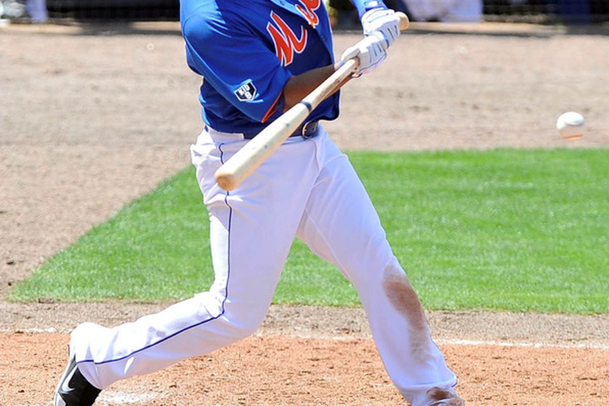 March 22, 2012; Port St Lucie, FL, USA;   New York Mets shortstop Ruben Tejada (11) at bat during the spring training game  against the Houston Astros  at Digital Domain Park. Mandatory Credit: Brad Barr-US PRESSWIRE