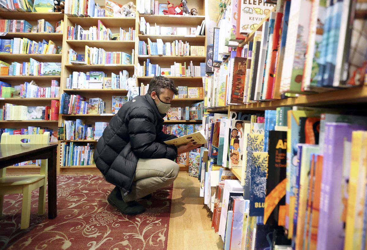 Zach Galanis shops for his son’s birthday at The King’s English Bookstore in Salt Lake City on Tuesday, Oct. 19, 2021.