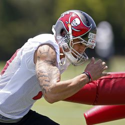 First-round pick Mike Evans works with a coach to improve his release against press coverage.