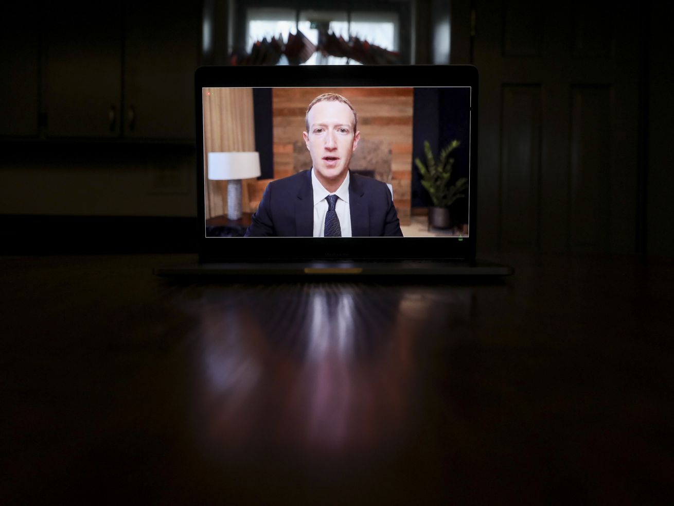 Mark Zuckerberg on a laptop screen.