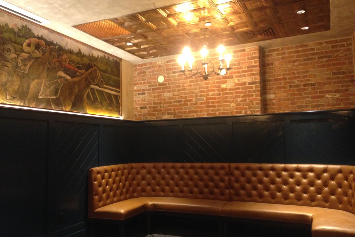 The private dining room at Worden Hall features a mural of the Saratoga race track by Mark Grundig