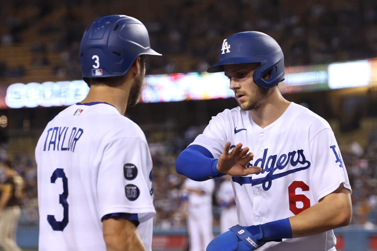Trea Turner #6 of the Los Angeles Dodgers celebrates his run with Chris Taylor #3, to take a 3-0 lead over the San Diego Padres, during the first inning at Dodger Stadium on September 29, 2021 in Los Angeles, California.