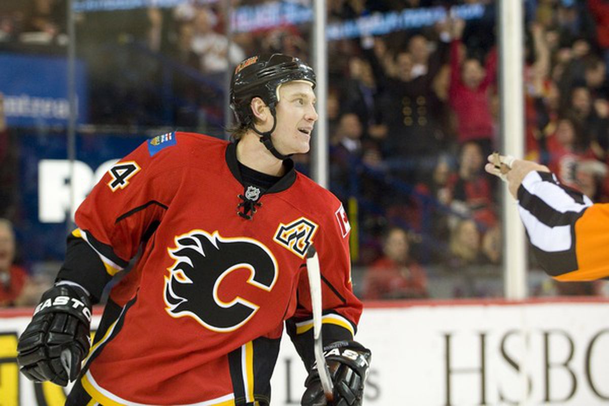 EDMONTON AB - NOVEMBER 29:  Jay Bouwmeester #4 of the Calgary Flames celebrates a second period goal against the Minnesota Wild at Scotiabank Saddledome on November 29 2010 in Calgary Alberta Canada. (Photo by Dylan Lynch/Getty Images)