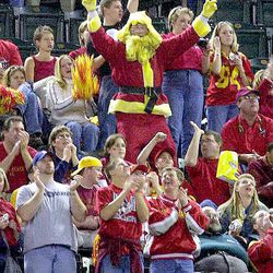 Iowa State fans surround a Santa Claus in Iowa State colors as they celebrate a touchdown against Pittsburgh during the first quarter of the Insight.com Bowl Thursday, Dec. 28, 2000 at Bank One Ballpark in Phoenix.