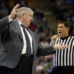 Head Coach Stew Morrill of Utah State talks with a referee during NCAA basketball against UNLV in Logan, Tuesday, Feb. 24, 2015.
