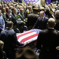 Utah Highway Patrol trooper Eric Ellsworth's casket arrives for funeral services at the Dee Events Center in Ogden on Wednesday, Nov. 30, 2016.
