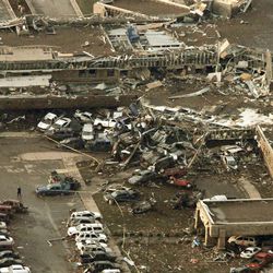 This aerial photo shows damage to Moore Medical Center after it was hit by a massive tornado in Moore, Okla., Monday May 20, 2013. A tornado roared through the Oklahoma City suburbs Monday, flattening entire neighborhoods, setting buildings on fire and landing a direct blow on an elementary school.