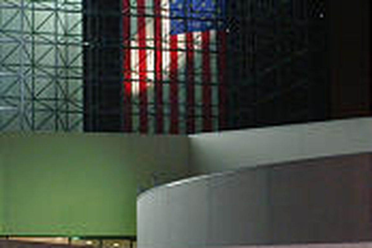 A giant U.S. flag hangs inside the John F. Kennedy Library in Boston, Friday evening. Today marks the 40th anniversary of the assassination of President Kennedy.
