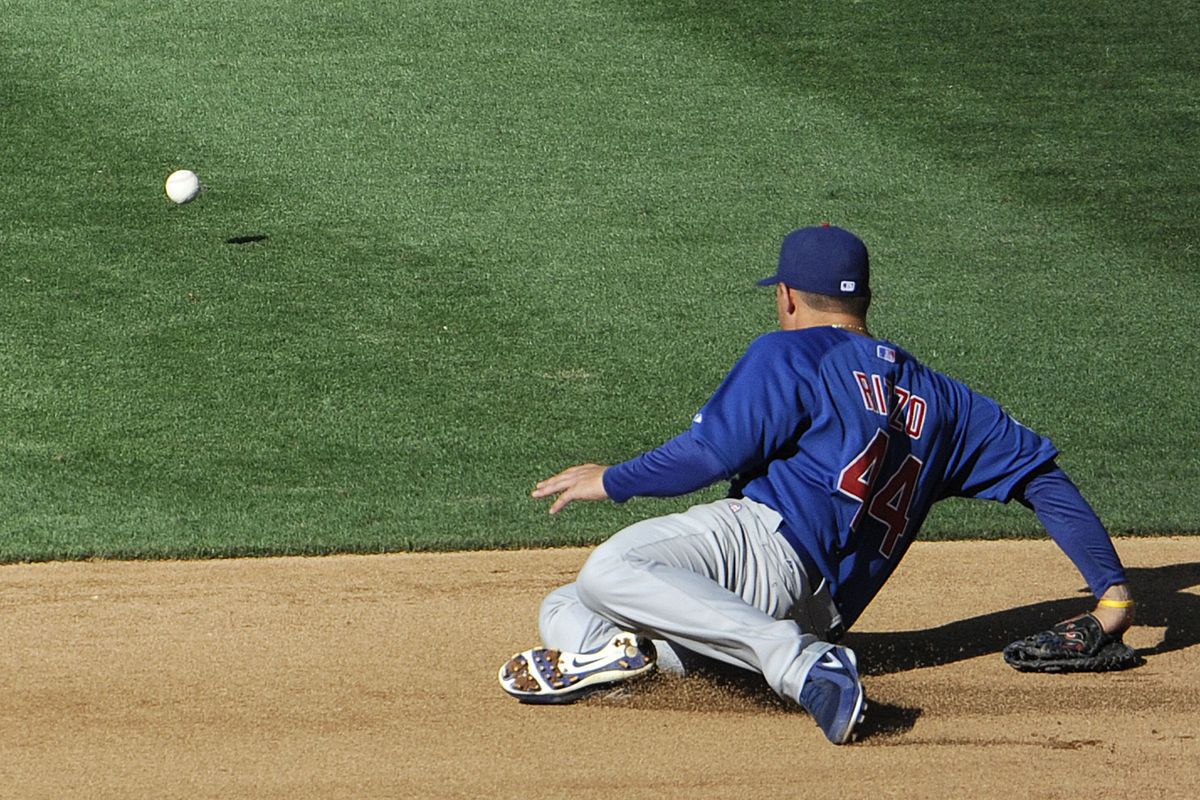 Anthony Rizzo of the Chicago Cubs dives for a single hit by Yonder Alonso of the San Diego Padres during a baseball game at Petco Park in San Diego, California.  (Photo by Denis Poroy/Getty Images)