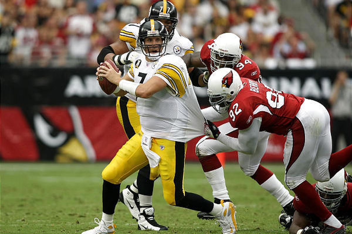 Pittsburgh quarterback Ben Roethlisberger attempts to elude the tackle of Bertrand Berry during the Cardinals' victory over the Steelers on Sunday in Arizona.