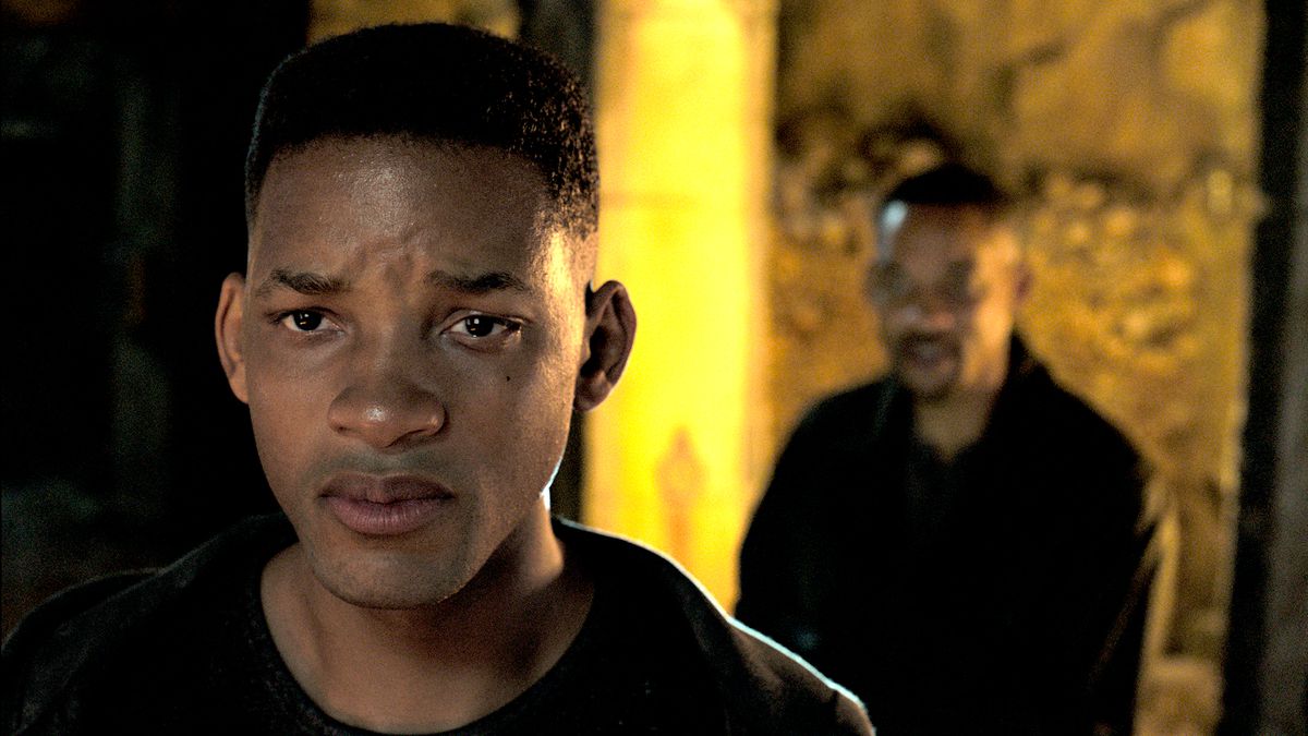 Will Smith stands behind a Young Will Smith who is near tears during an interrogation