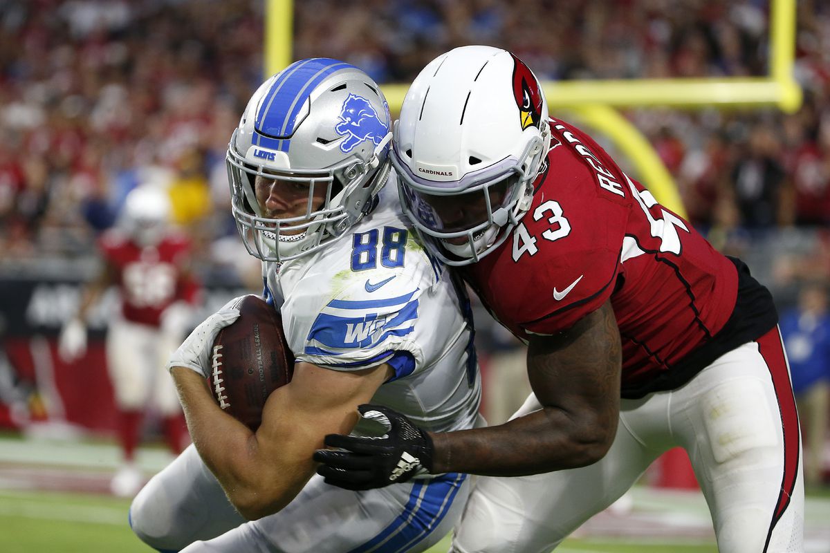 Tight end T.J. Hockenson of the Detroit Lions is tackled by Haason Reddick of the Arizona Cardinals after a reception during the second half of the NFL football game at State Farm Stadium on September 08, 2019 in Glendale, Arizona.