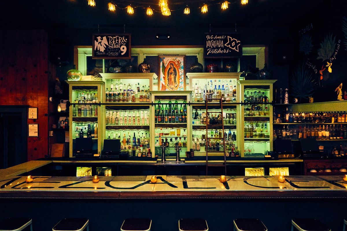 The glowing mezcal bar at Las Perlas.